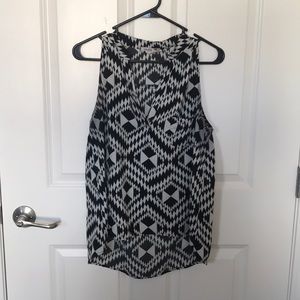 Sleeveless black and White blouse